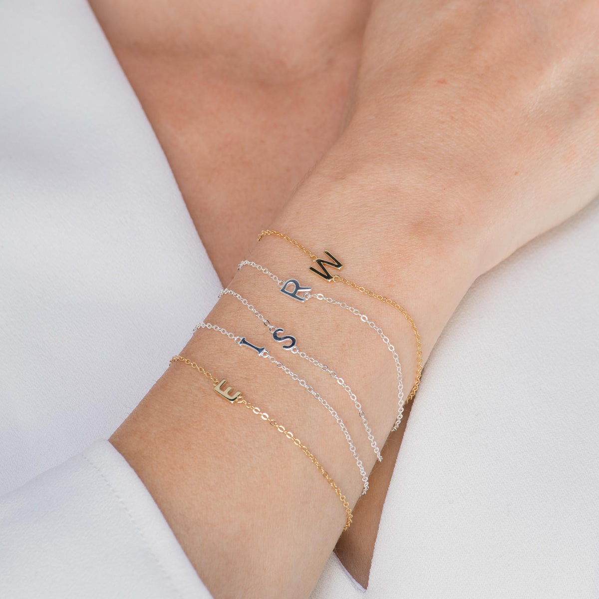 Rose gold sideways letter bracelet – Vessaly