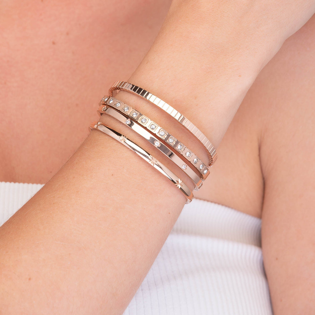 Gold hinged bangle with zirconia stones