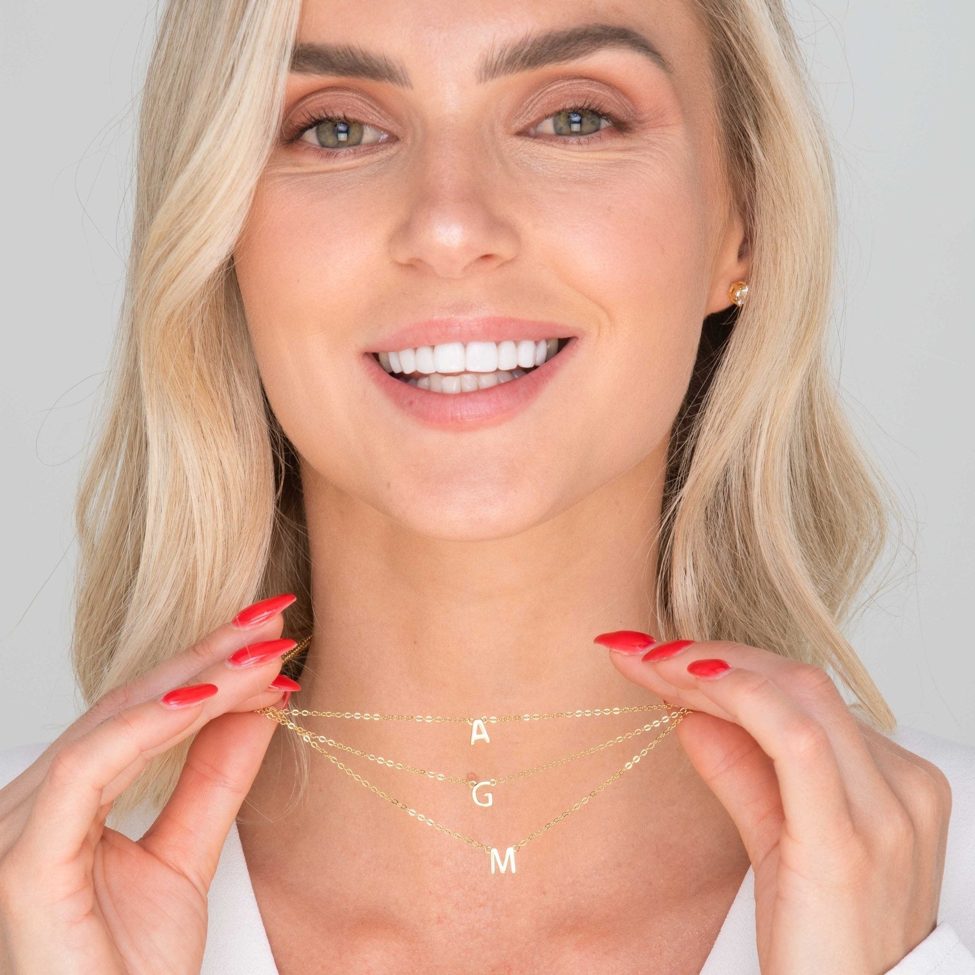 18K gold vermeil letter necklace styled on a model