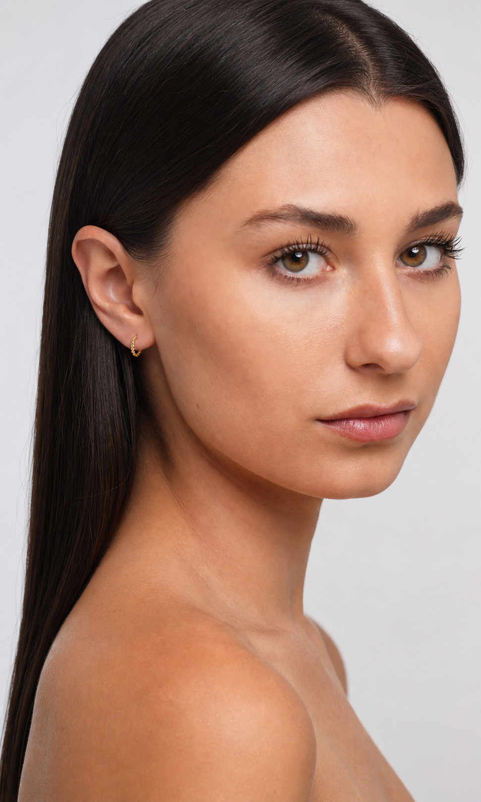 Small 14K Gold-Plated Thin Hoop Earrings worn by model three-quarter view