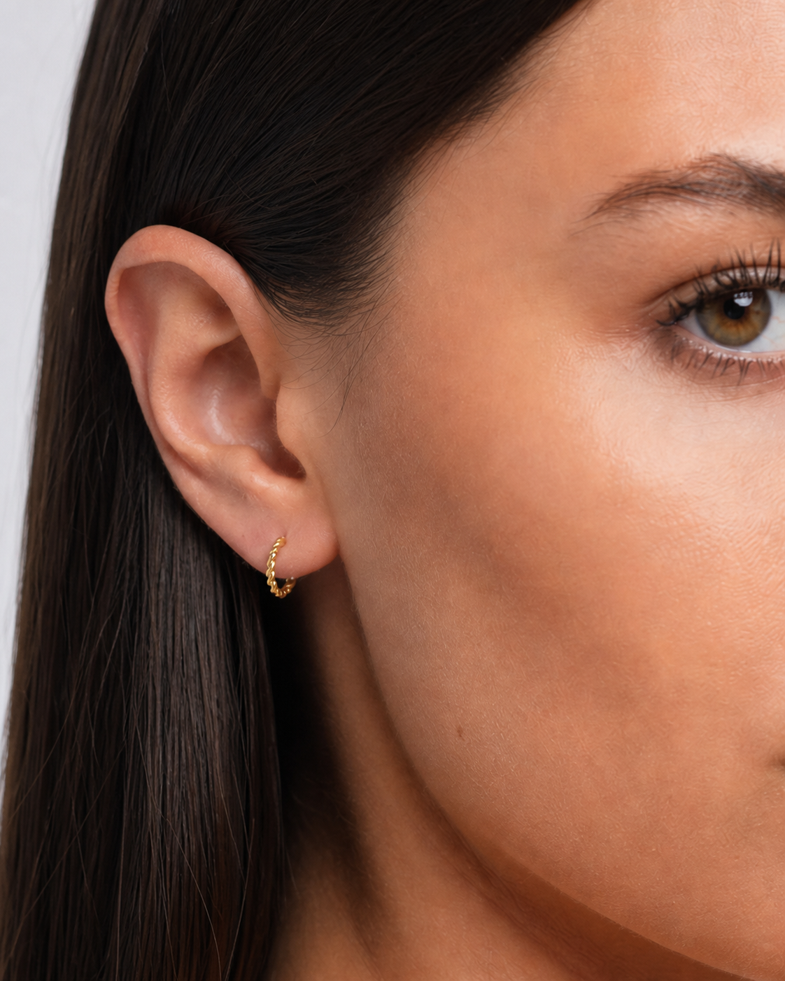 Small 14K Gold-Plated Thin Hoop Earrings worn by model ear close-up