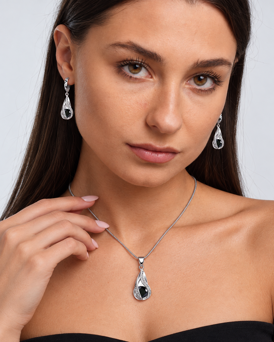 Black Crystal Twist Necklace & Earring Set in Black, worn by a model in a close-up - Vessaly