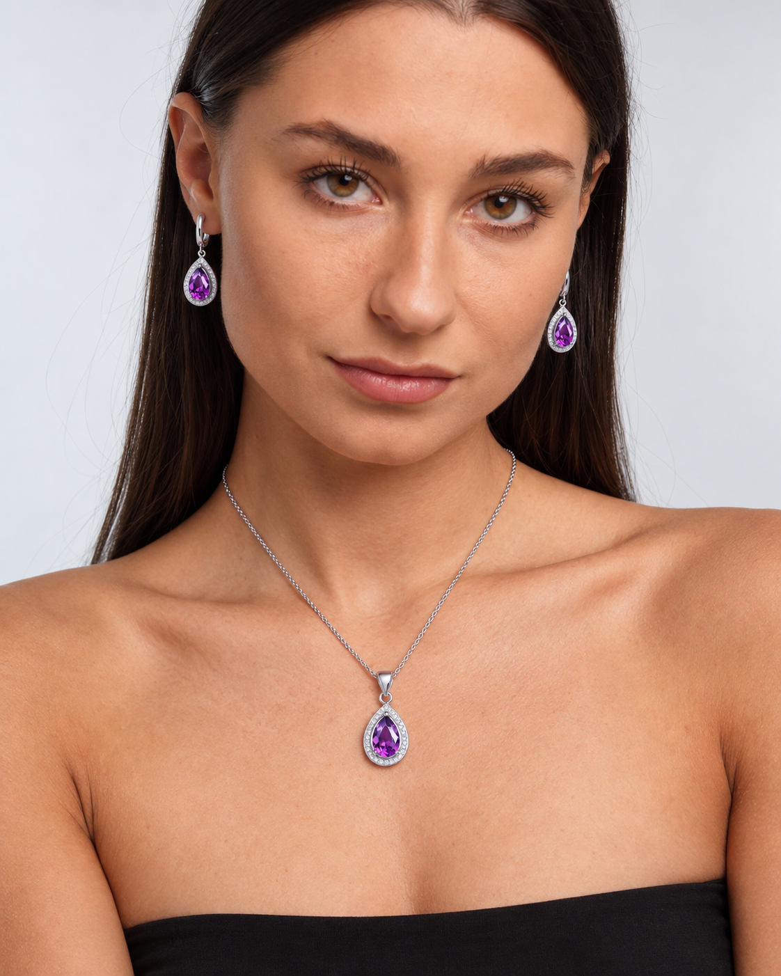 Color Crystal Teardrop Necklace & Earring Set in Purple, worn by a model in a front portrait - Vessaly