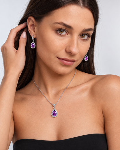 Color Crystal Teardrop Necklace & Earring Set in Purple, worn by a model in a three-quarter portrait - Vessaly