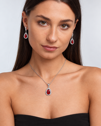 Color Crystal Teardrop Necklace & Earring Set in Red, worn by a model in a front portrait - Vessaly