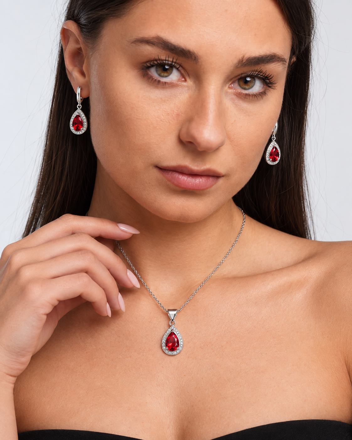 Color Crystal Teardrop Necklace & Earring Set in Red, worn by a model in a close-up - Vessaly