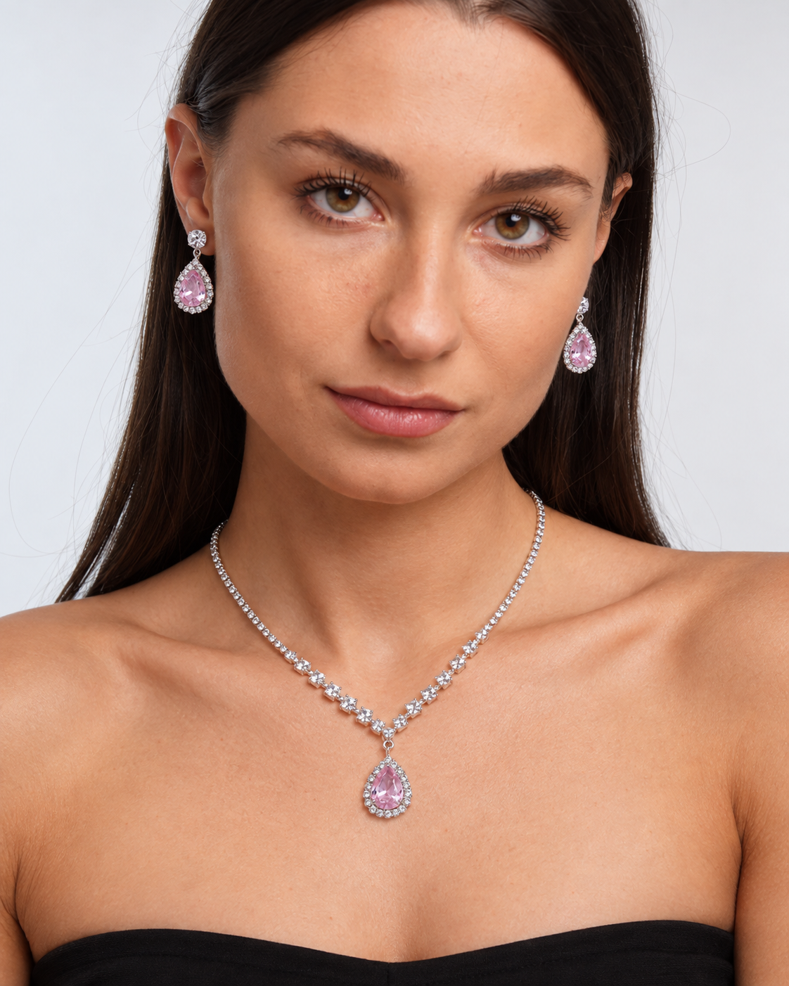 Crystal Teardrop Necklace & Earring Set in Silver / Pink, worn by a model in a front portrait - Vessaly