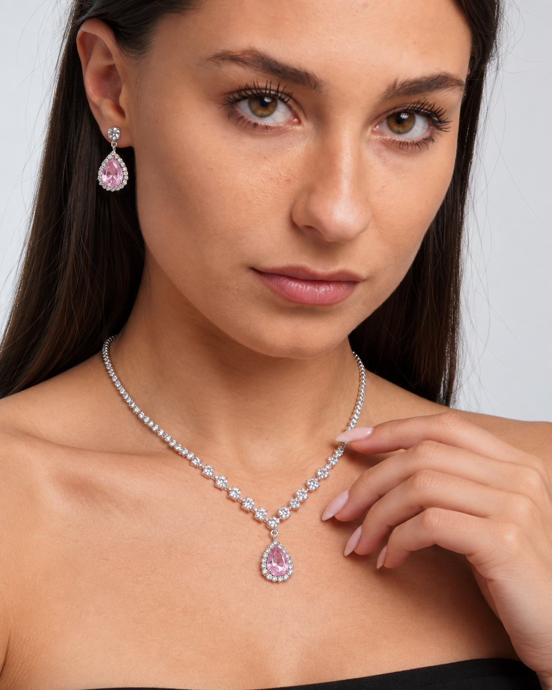 Crystal Teardrop Necklace & Earring Set in Silver / Pink, worn by a model in a close-up - Vessaly