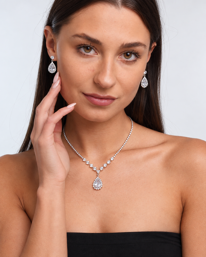 Crystal Teardrop Necklace & Earring Set in Silver / Clear, worn by a model in a front portrait - Vessaly