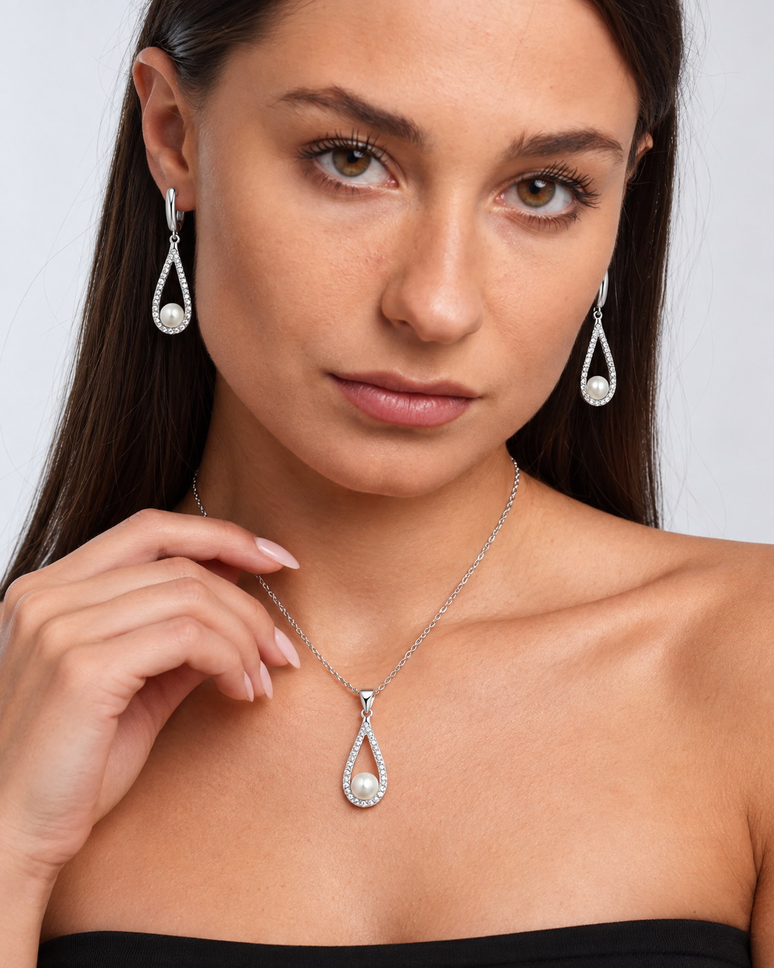 Pearl Teardrop Necklace & Earring Set in Silver, worn by a model in a close-up - Vessaly