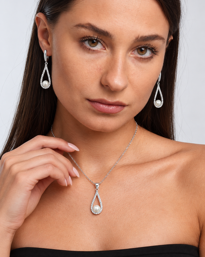 Pearl Teardrop Necklace & Earring Set in Silver, worn by a model in a close-up - Vessaly