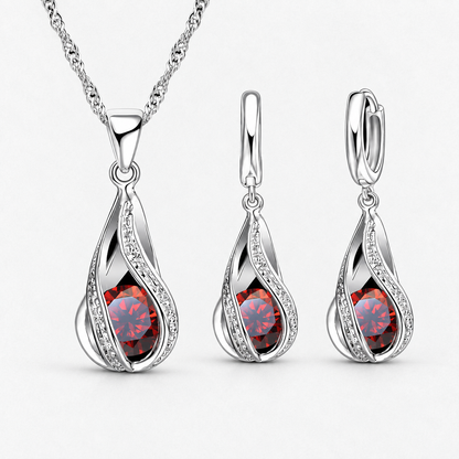 Twist Teardrop Crystal Necklace & Earring Set in Red, product view on a white background - Vessaly