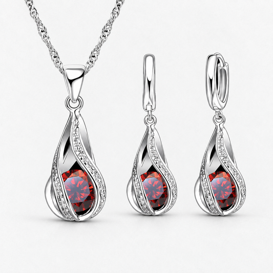 Twist Teardrop Crystal Necklace & Earring Set in Red, product view on a white background - Vessaly