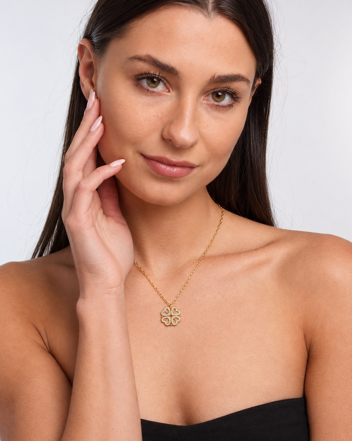 Model wearing Clover Heart Locket Necklace — gold — view 1