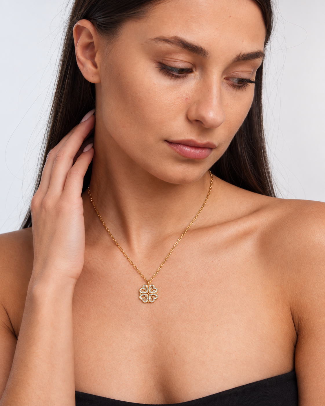 Model wearing Clover Heart Locket Necklace — gold — view 2