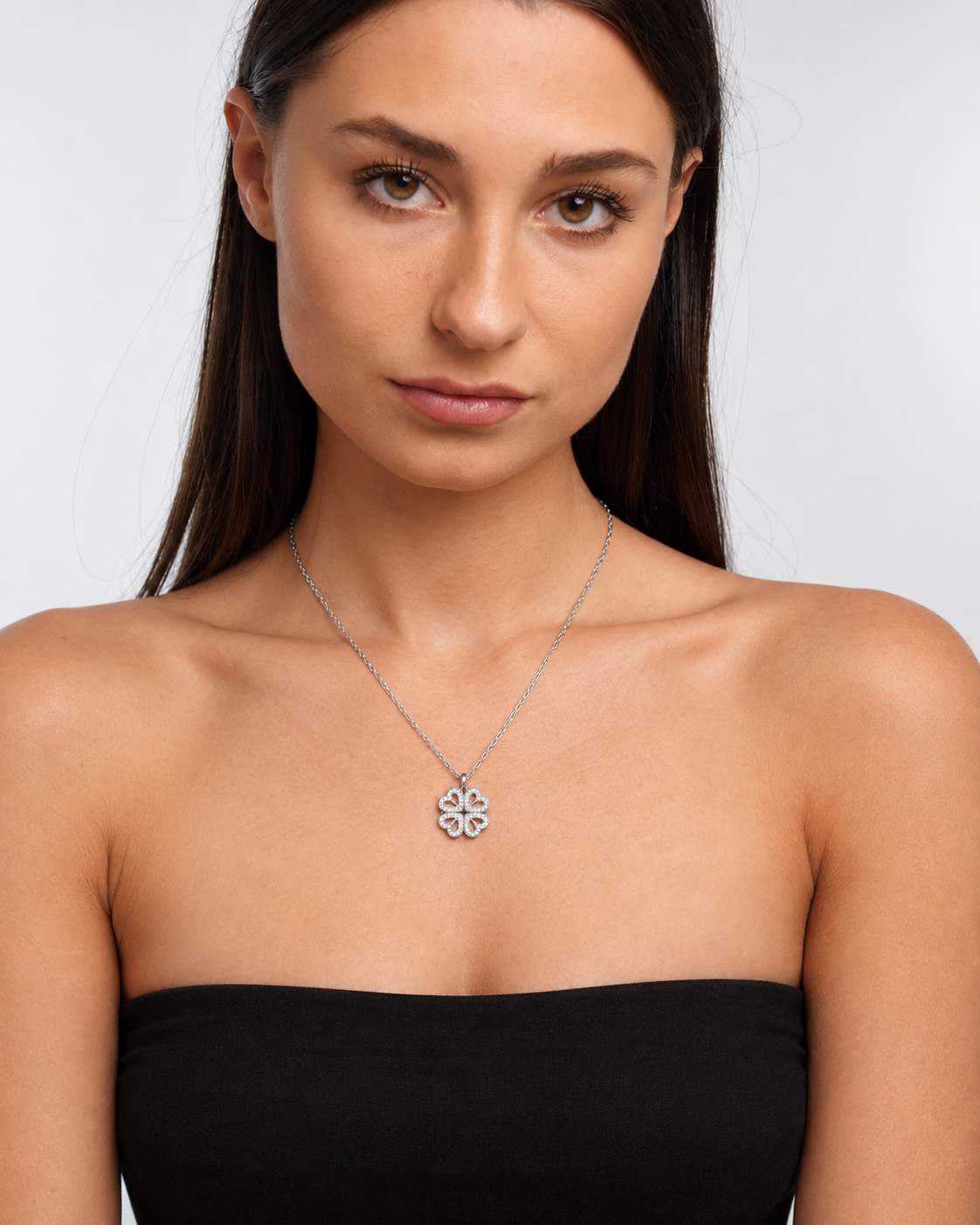 Model wearing Clover Heart Locket Necklace — silver — view 1